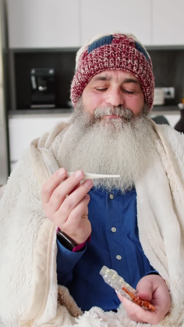 Elderly Man Taking Temperature and Medication