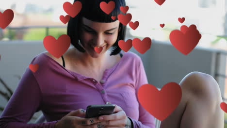 woman sitting on a chair while texting