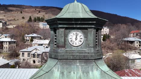 Aerial-view-of-Clock-Tower-zooming-out-|-Nymfaio-village-|-Nikios-Scholi