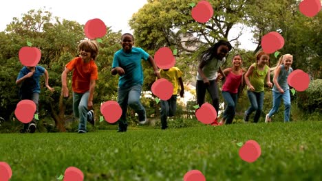 apple icons falling against kids running in the park