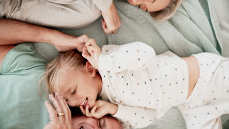 top view, bedroom and parents playing with child