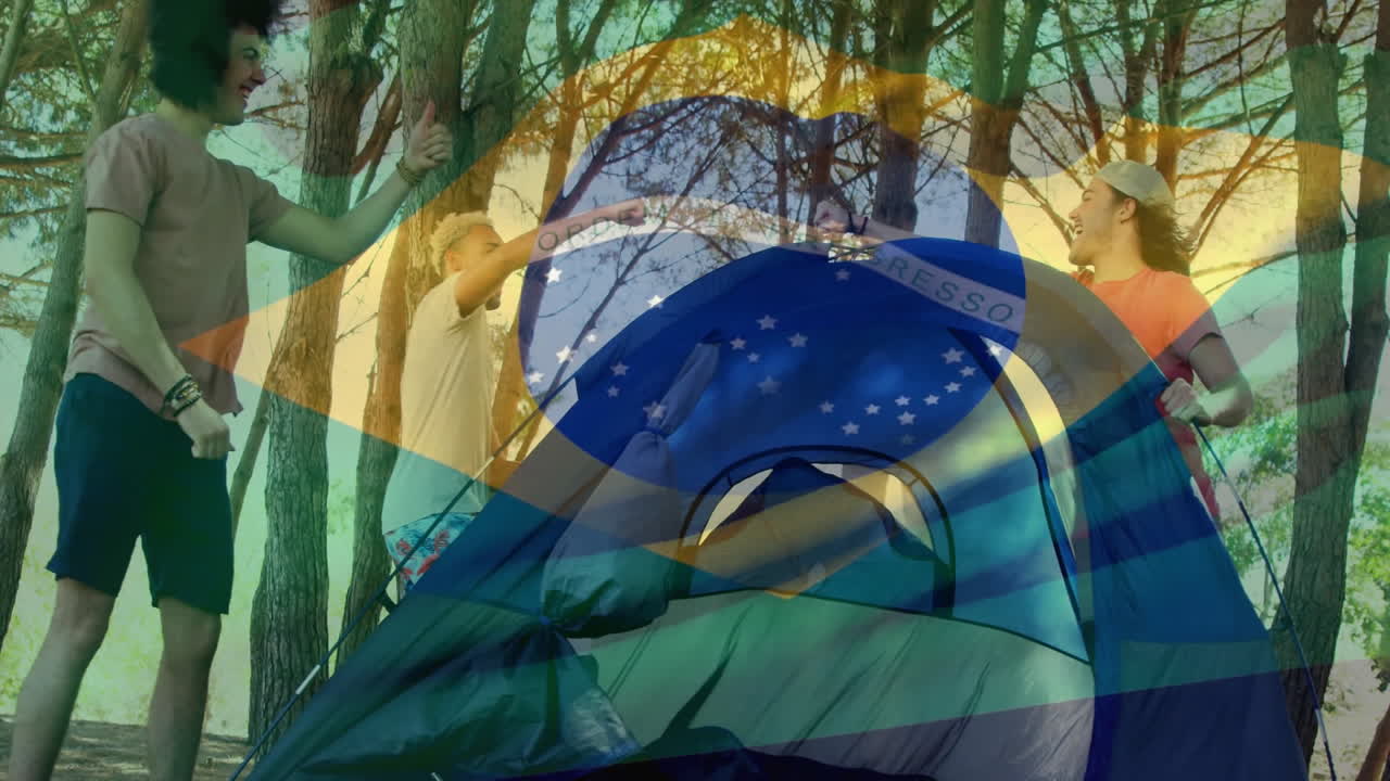 animación de la bandera brasileña sobre la gente montando una tienda en el bosque