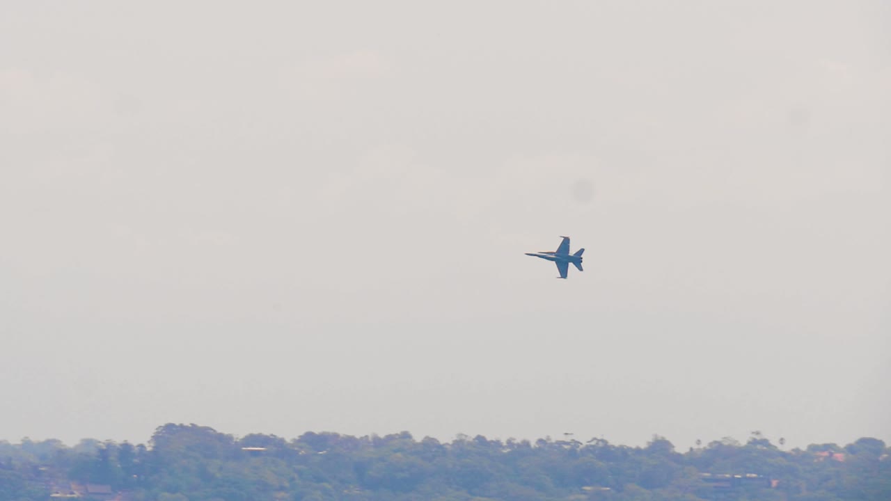 Rare slow motion footage of an Australian F-A-18 Super Hornet banking as it flies over Sydney on Australia day. The jet fighter flies over Sydney buildings as part of the Australia day celebrations