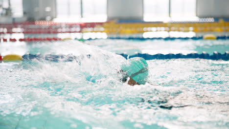 swimmers in an indoor swimming pool