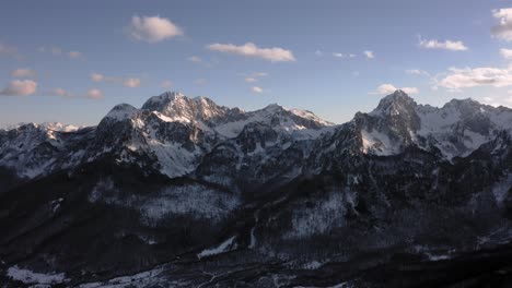 AERIAL---Beautiful-snowy-winter-in-the-mountains,-Kolasin,-Montenegro,-reverse-shot