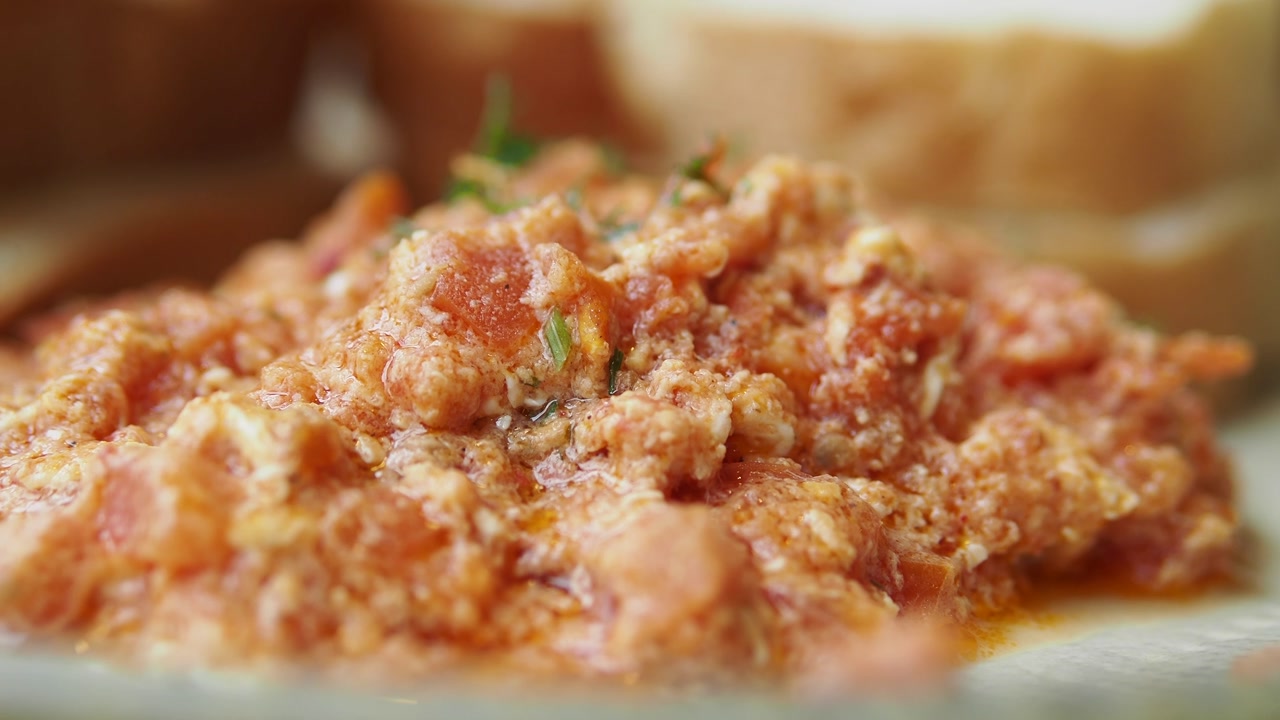 Delicious Scrambled Eggs with Tomatoes and Herbs for Breakfast