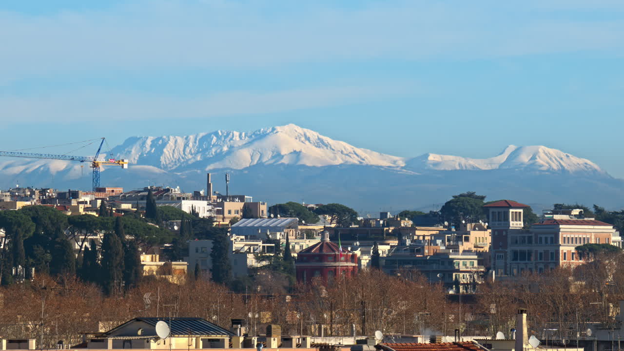 Aerial view of mountains and buildings at sunset near Rome, Italy