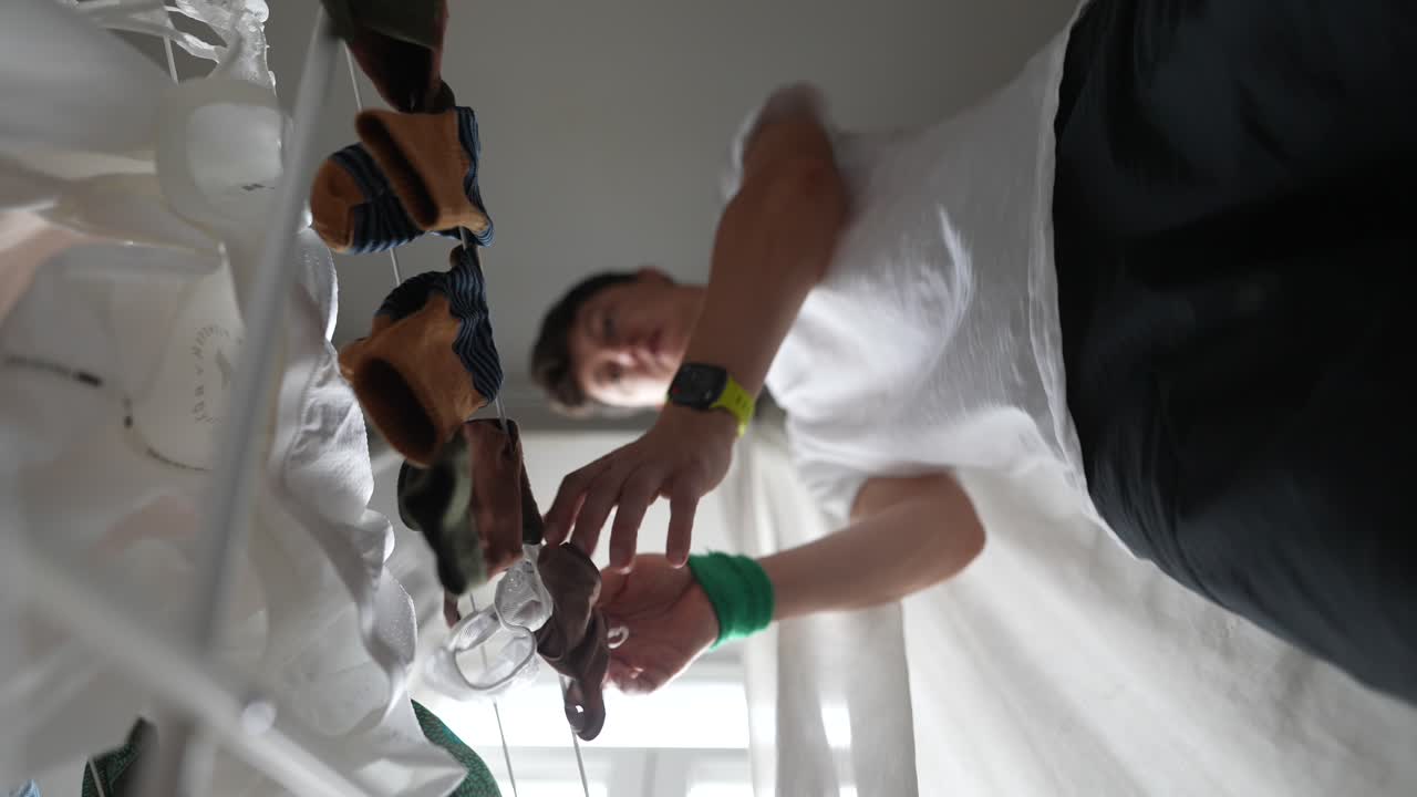 Person Drying Clothes