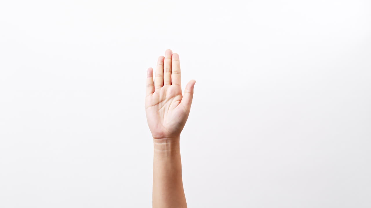 Female hands alternating handfuls isolated on a white studio background with copy space for placing a text for an advertisement.