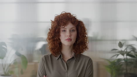 portrait successful red head business woman confident arms crossed enjoying professional career beautiful stylish female in office