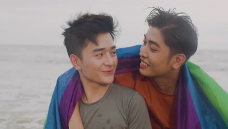 couple holding rainbow flag