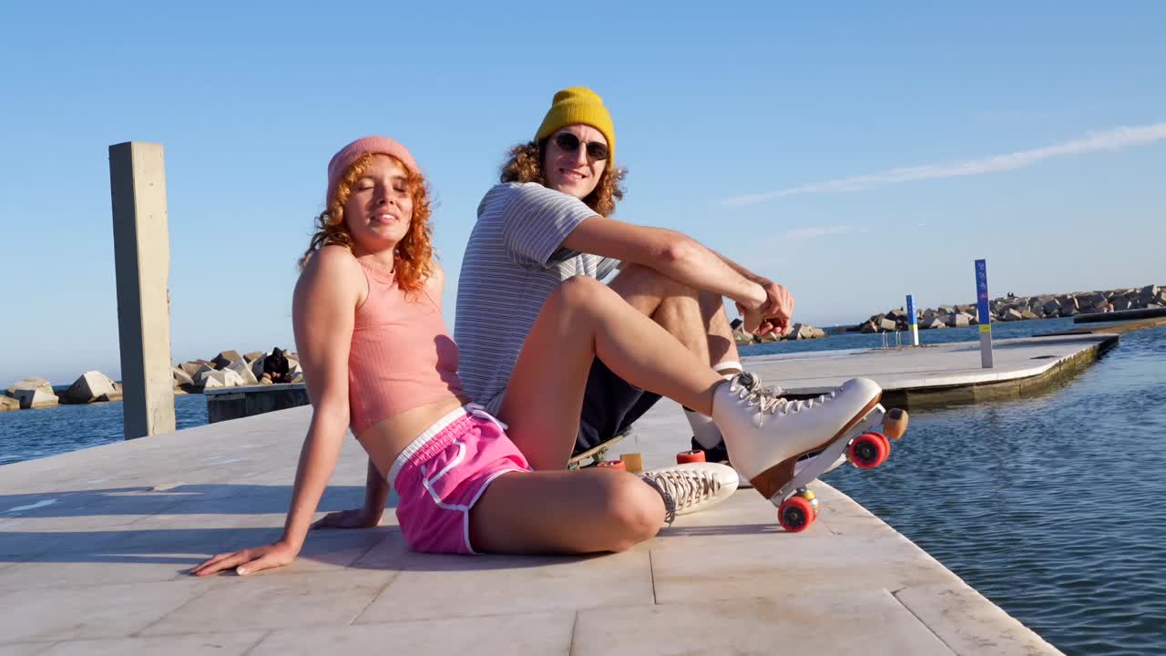 Young Couple Roller Skating on the Beach