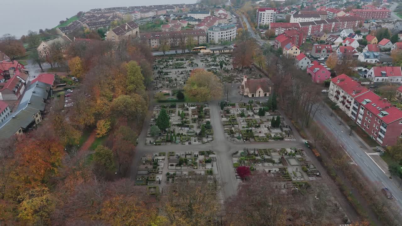 Aerial view of a graveyard in the small town Ystad, in Österlen, South Sweden, cloudy, autumn