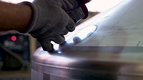 factory worker cut metal construction using angle grinder