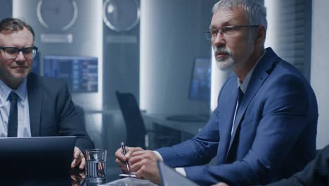 ceo of the company holds briefing with executives and top managers, having discussion in the conference room. businesspeople strategizing and talking at the business meeting