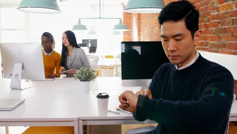 male executive using smartwatch