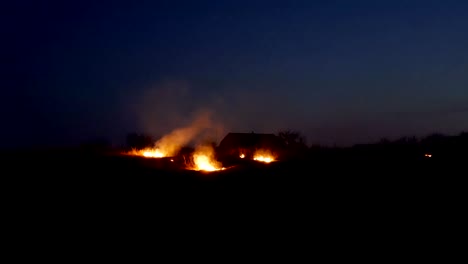 fire on the farmers field at night