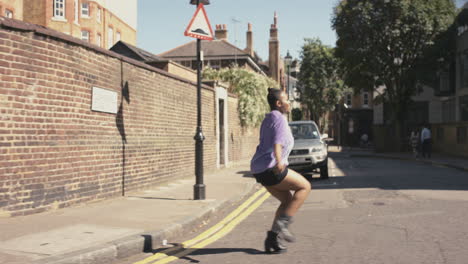 contemporary funky african american woman street dancer dancing freestyle in the city