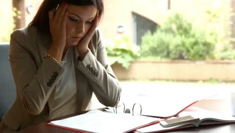 Businesswoman-working-on-papers