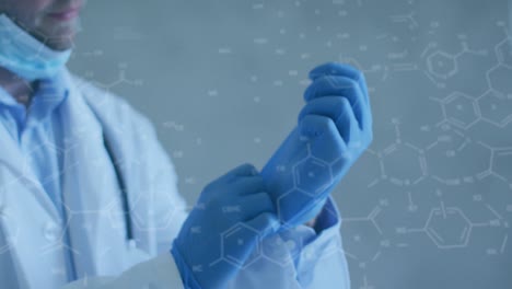 animation of chemical structures over caucasian male doctor wearing face mask and gloves