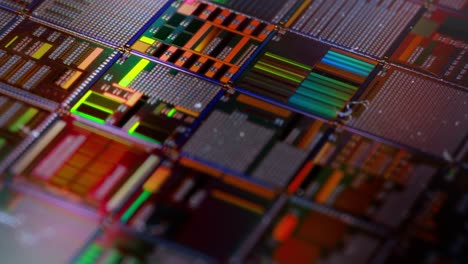 Silicon-semiconductor-wafer-close-up.-In-electronics,-a-wafer-also-called-a-slice-or-substrate-is-a-thin-slice-of-semiconductor,-a-crystalline-silicon,-used-for-the-fabrication-of-integrated-circuits