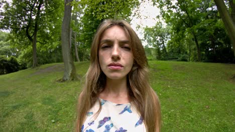 allergic woman in the park suffers from pain due to allergens