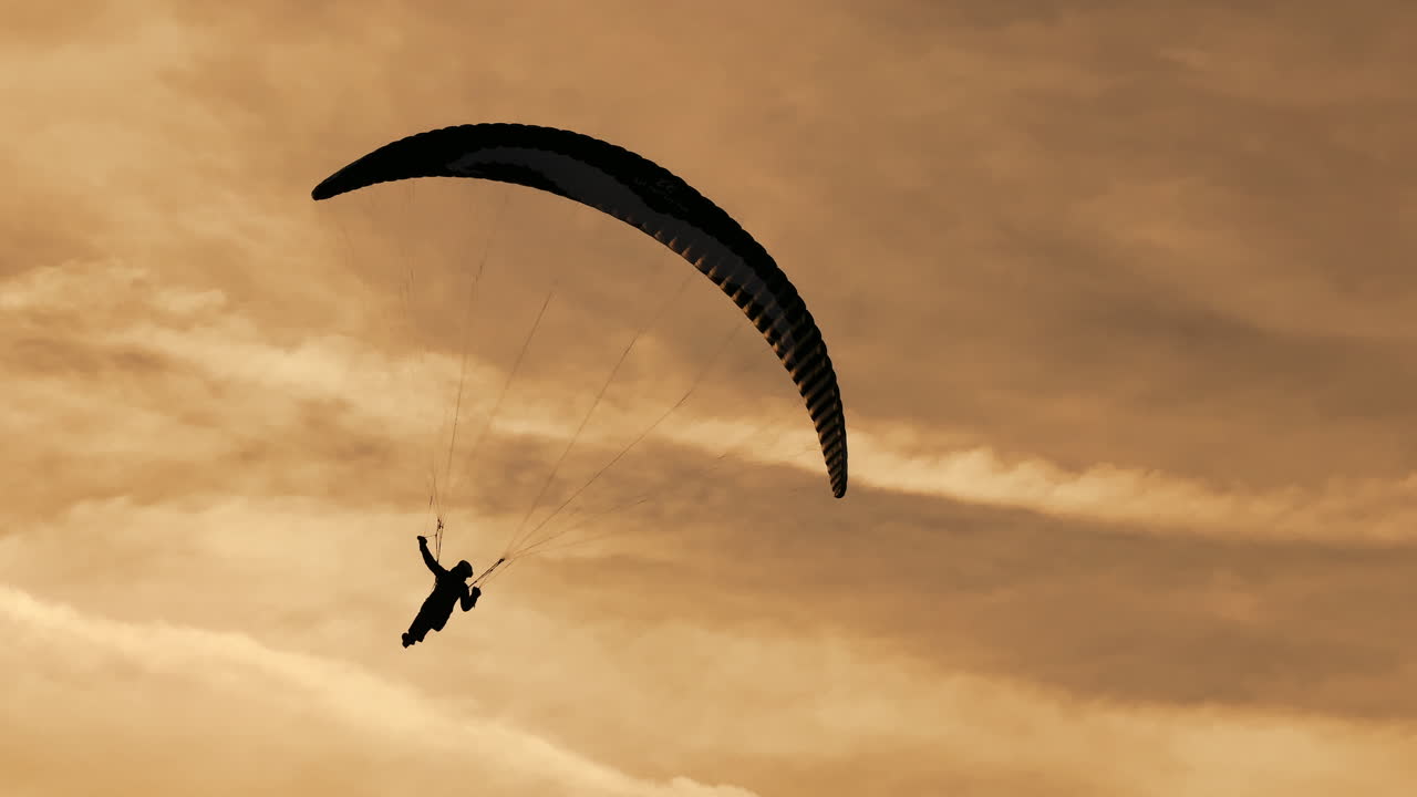 Paragliding Silhouette at Sunset