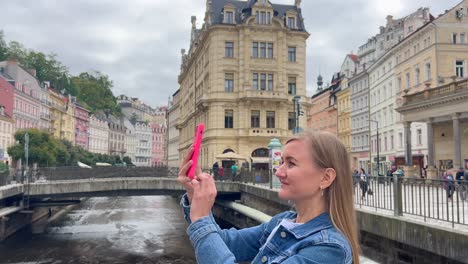 a beautiful girl uses a smartphone to photograph a 4k 2025 08 04 04 32 48 utc.mov | alfama, architecture, building, castle