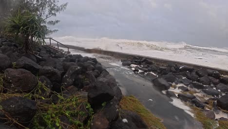 intense waves smashing during cyclone alfred at snapper rocks, gold coast, australia. panning shot