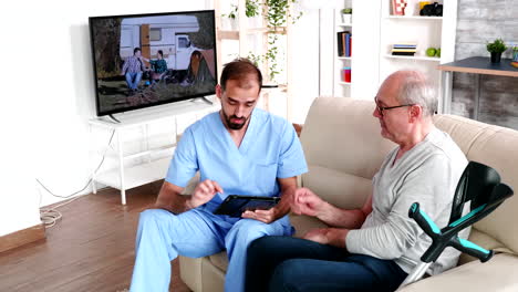 Experienced-doctor-taking-notes-on-tablet-computer