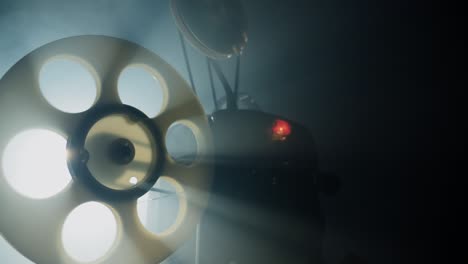 reel with a film rotating and light rays. old movie projector