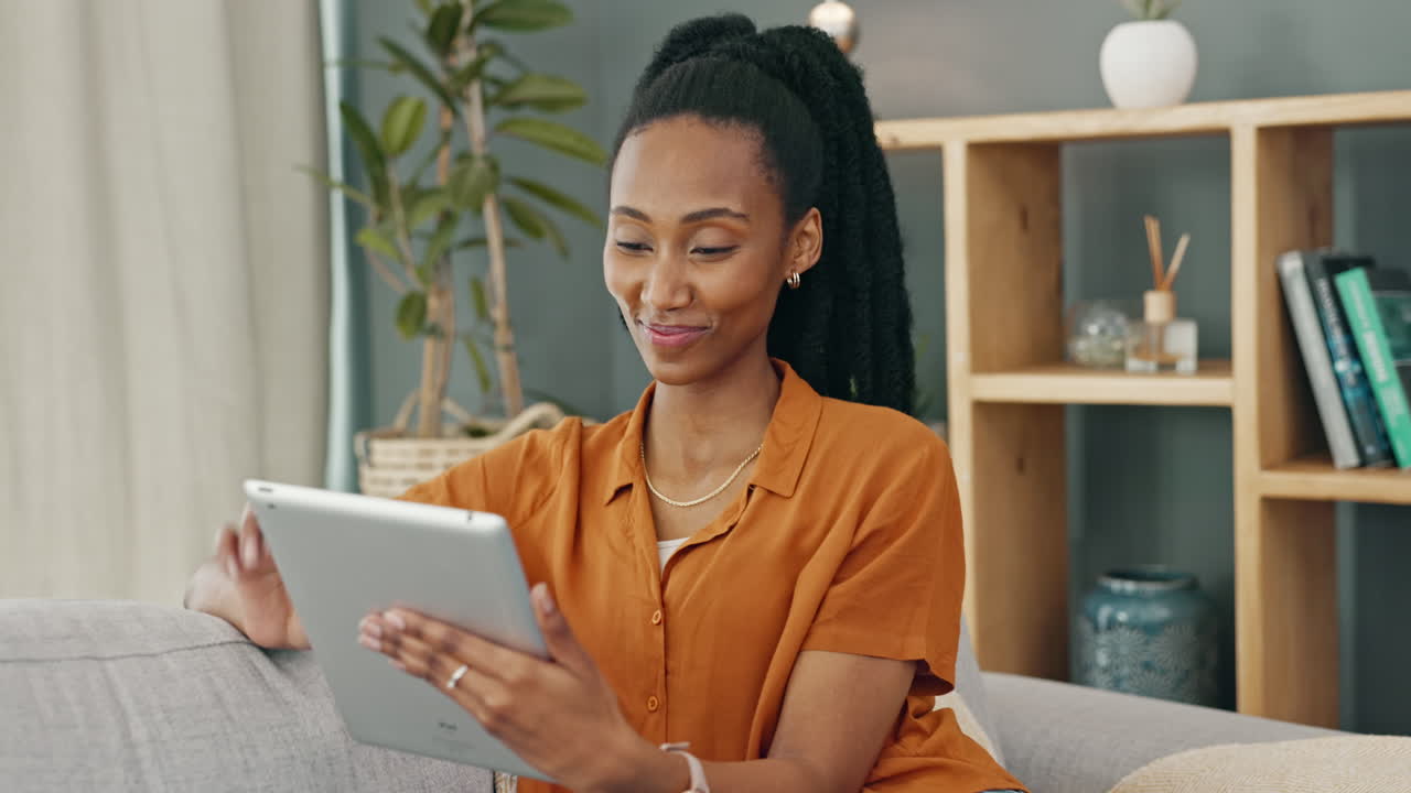 Woman using a tablet at home
