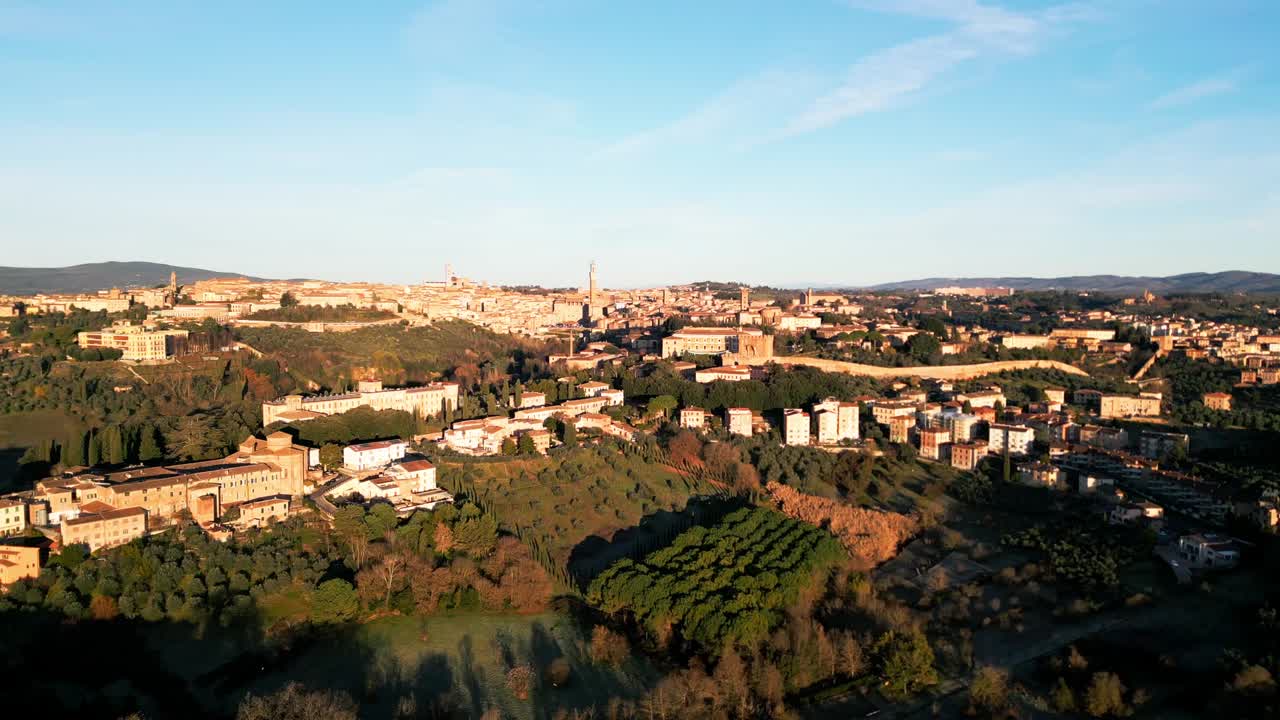 Drone aerial view of an Italian village bathed in sunlight. Perfect for travel, scenic landscapes, and cultural content