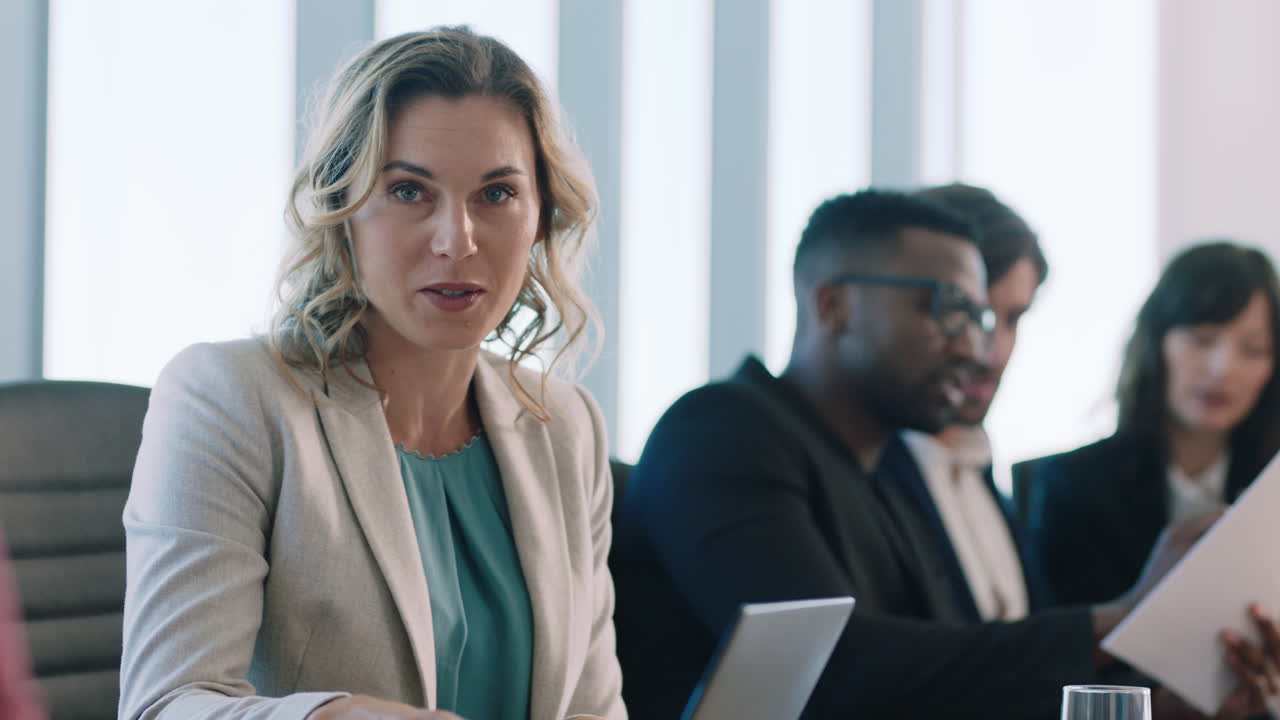 corporate business people meeting in boardroom brainstorming colleagues discussing strategy sharing problem solving ideas working on deadline collaborating in busy office 4k