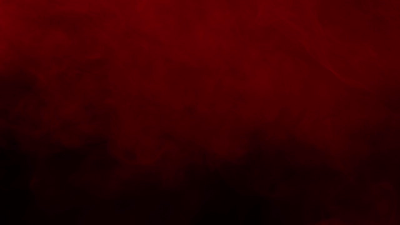 Slow moving dark red clouds, fog, or smoke create moody and atmospheric texture, abstract background for horror or dramatic cinematic projects