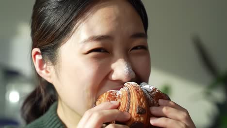 a joyful indulgence: a young woman enjoys a delectable pastry, capturing the bliss of culinary delight and personal satisfaction in every bite