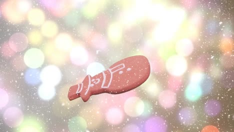Animation-of-christmas-snowman-gingerbread-cookie-over-snow-falling-and-bokeh-lights