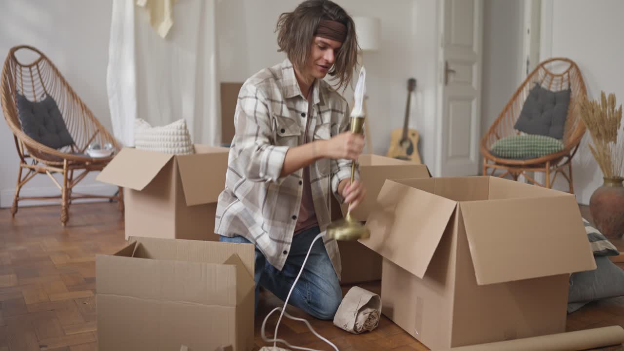 Person unpacking boxes in a new home