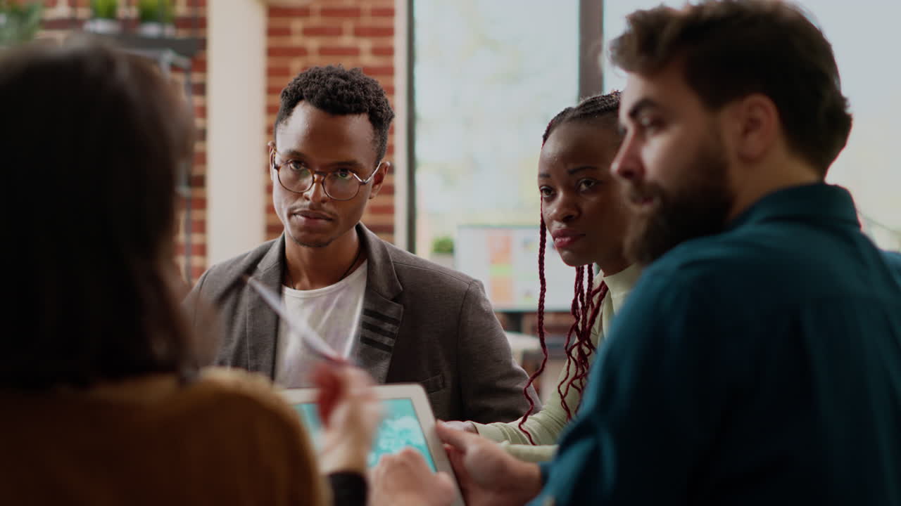Diverse group of coworkers planning data presentation