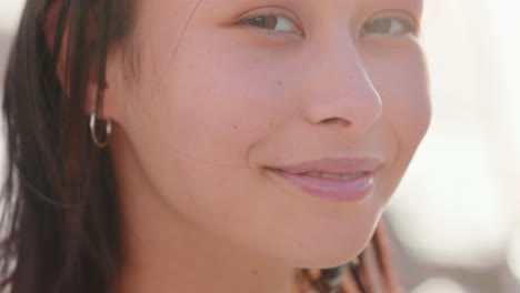 portrait-of-beautiful-asian-woman-smiling-enjoying-cloudy-seaside-exploring-vacation-lifestyle-with-wind-blowing-hair-on-beach