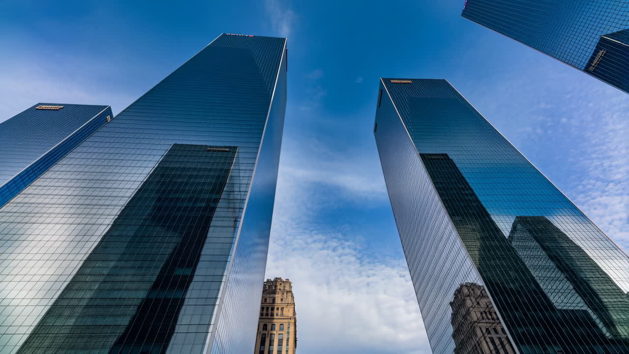 Modern Skyscrapers with Reflective Glass Against a Blue Sky