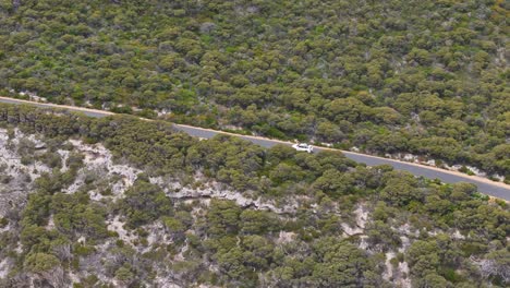 Drone-flying-alongside-scenic-road-in-Margaret-River,-Western-Australia