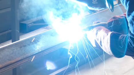 welding, worker is welding, close-up and welding fumes