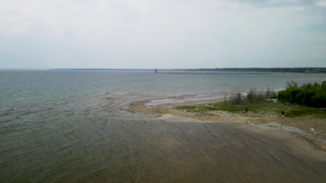 Aerial-flight-toward-Manistique-Lighthouse,-Michigan