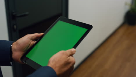 manager hands holding tablet walking office closeup. chroma key digital device