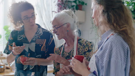 grandmother teaching grandchildren how to cook fresh tomatoes
