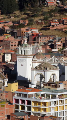 experience a stunning aerial view of copacabana, bolivia, focusing on the majestic basilica of our lady of copacabana
