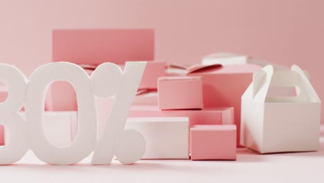 minus thirty per cent text in white with pink and white gift boxes on pink background