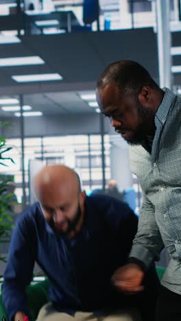 vertical video multicultural group of ceos welcoming each other in a negotiations meeting