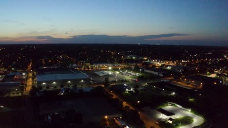 traffic on the freeway in the city of grand rapids, michigan being revealed by a drone in the morning light